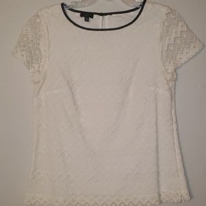 Talbott petite top with leather trim around neck.